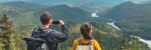 Hikers couple taking a photo on their phone