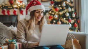 A woman buys gifts on her laptop during the holidays.