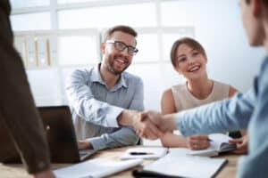 business man shaking hands with a client.