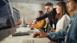 An IT team looking at computers.