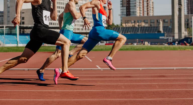 sprinters running a race on a track